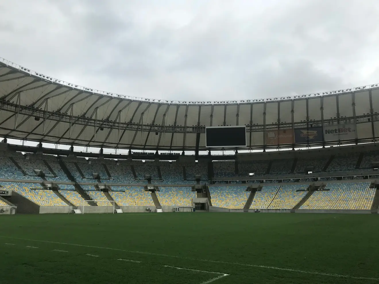 The empty stands and grass field at Maracana Stadium in Rio de Janeiro.