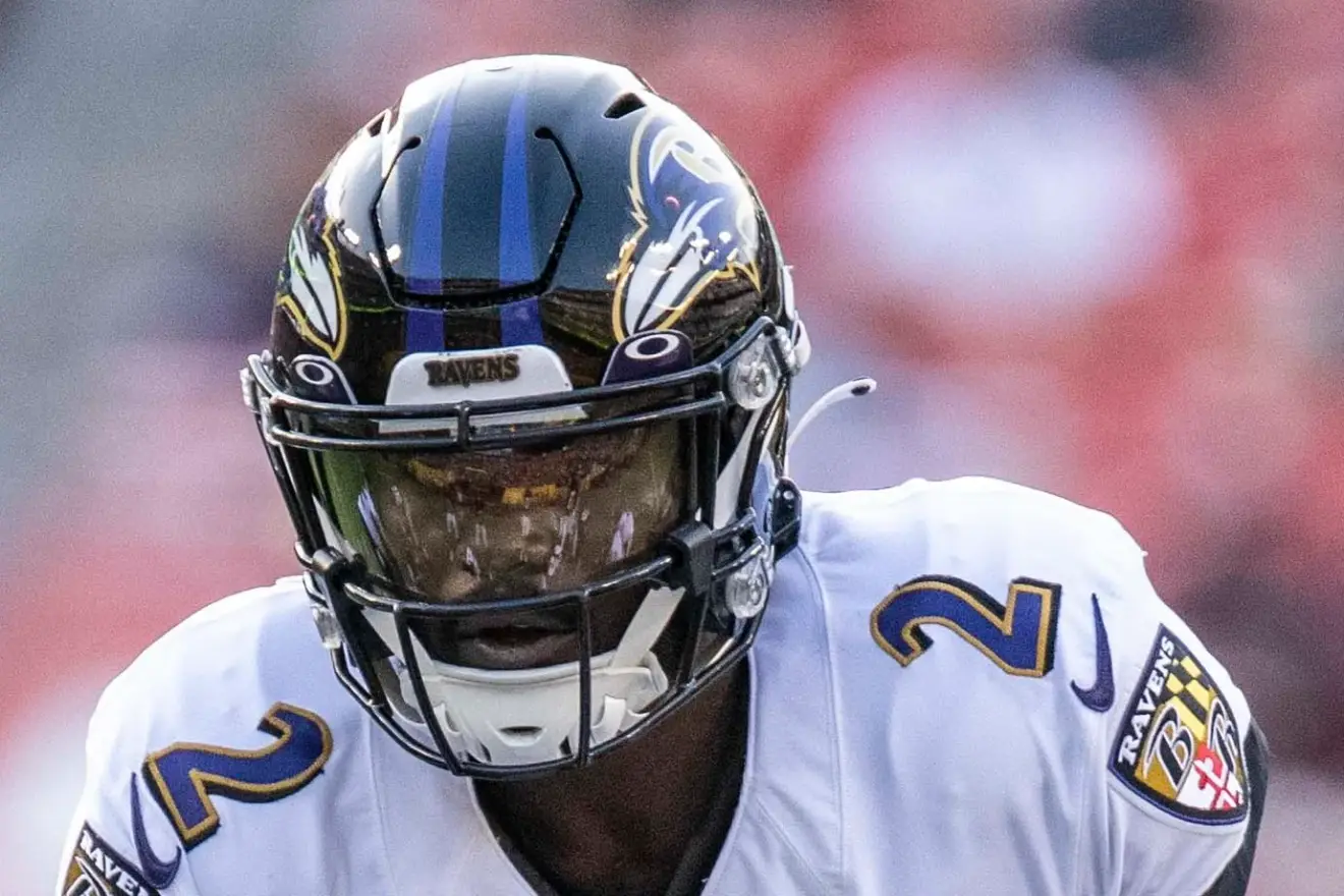 Archival close-up of Tyler Huntley wearing a white Baltimore Ravens jersey and helmet in 2021