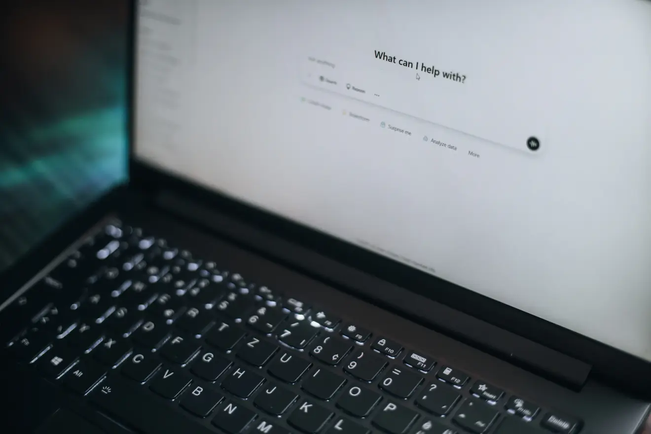 A laptop displaying the ChatGPT home screen