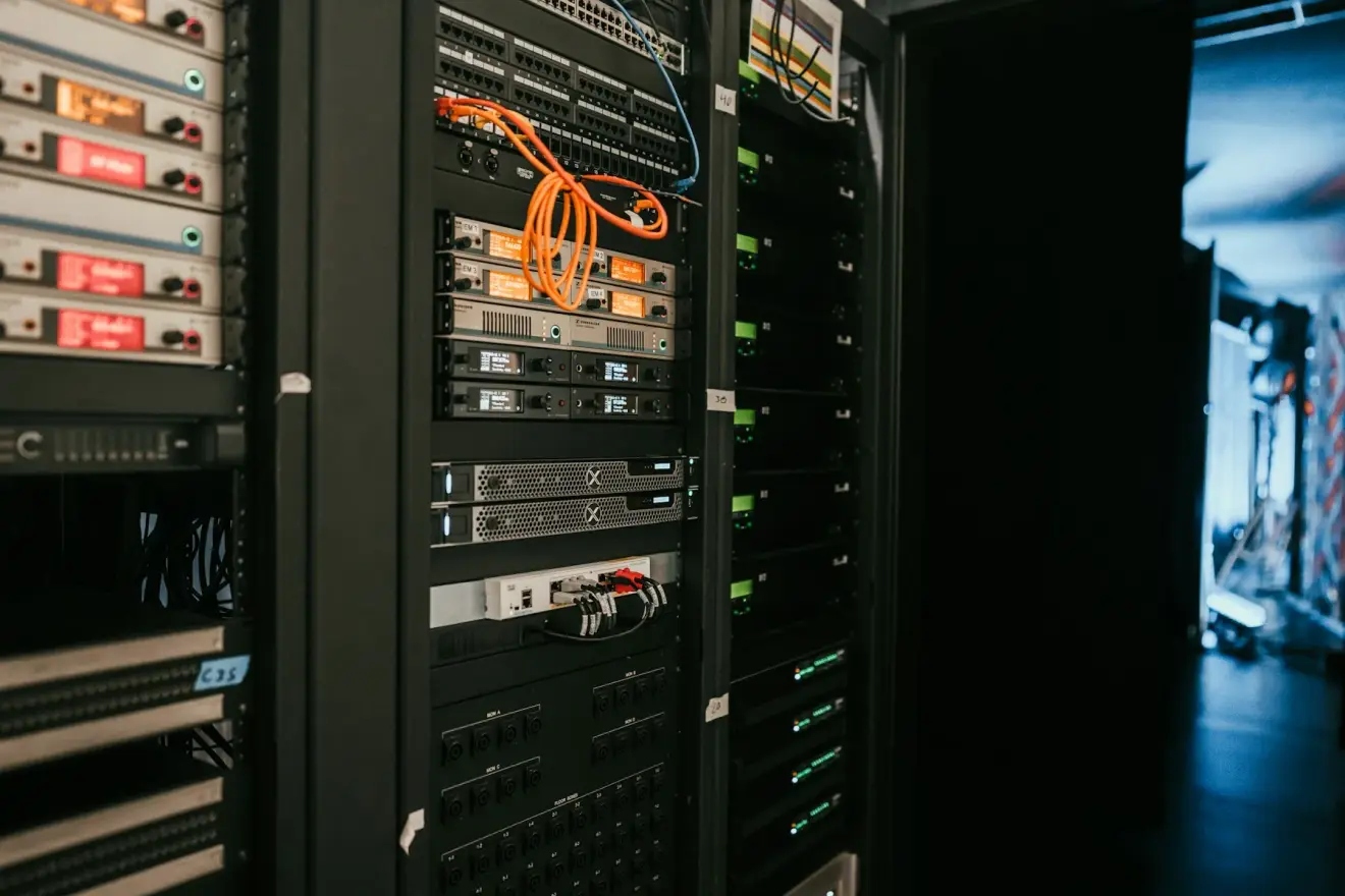 Server racks containing computing equipment and orange network cables